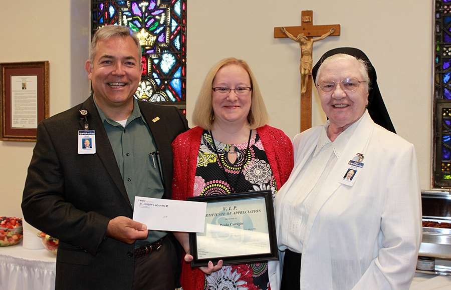 (Left to right) Skip Gjolberg, St. Joseph’s Hospital administrator; Paula Cutright, executive assistant to the administrator; and Sister Francesca Lowis, vice president of mission integration